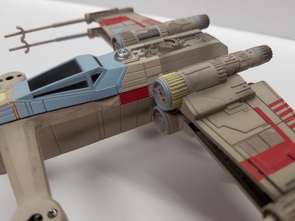 a closeup view of x wing drone from the left